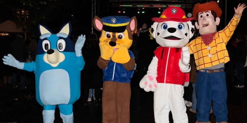 Bluey, Chase, Marshall and Woody Characters from Jungle Play at the Christmas Lights